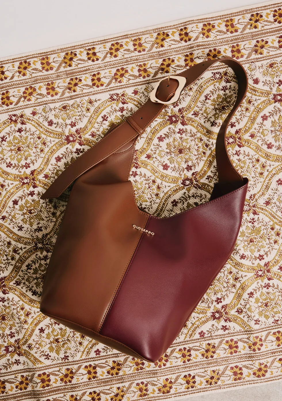 BOLSO MAXI BUCKET MARRÓN Y MORADO